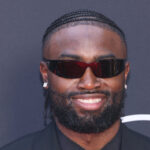 Jaylen Brown posing on the red carpet.