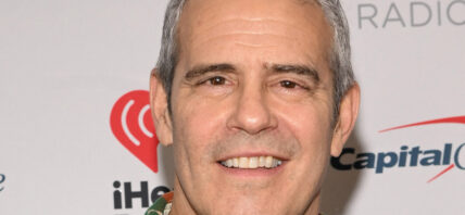 Andy Cohen posing on the red carpet.