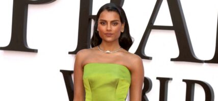 Simone Ashley in a green dress