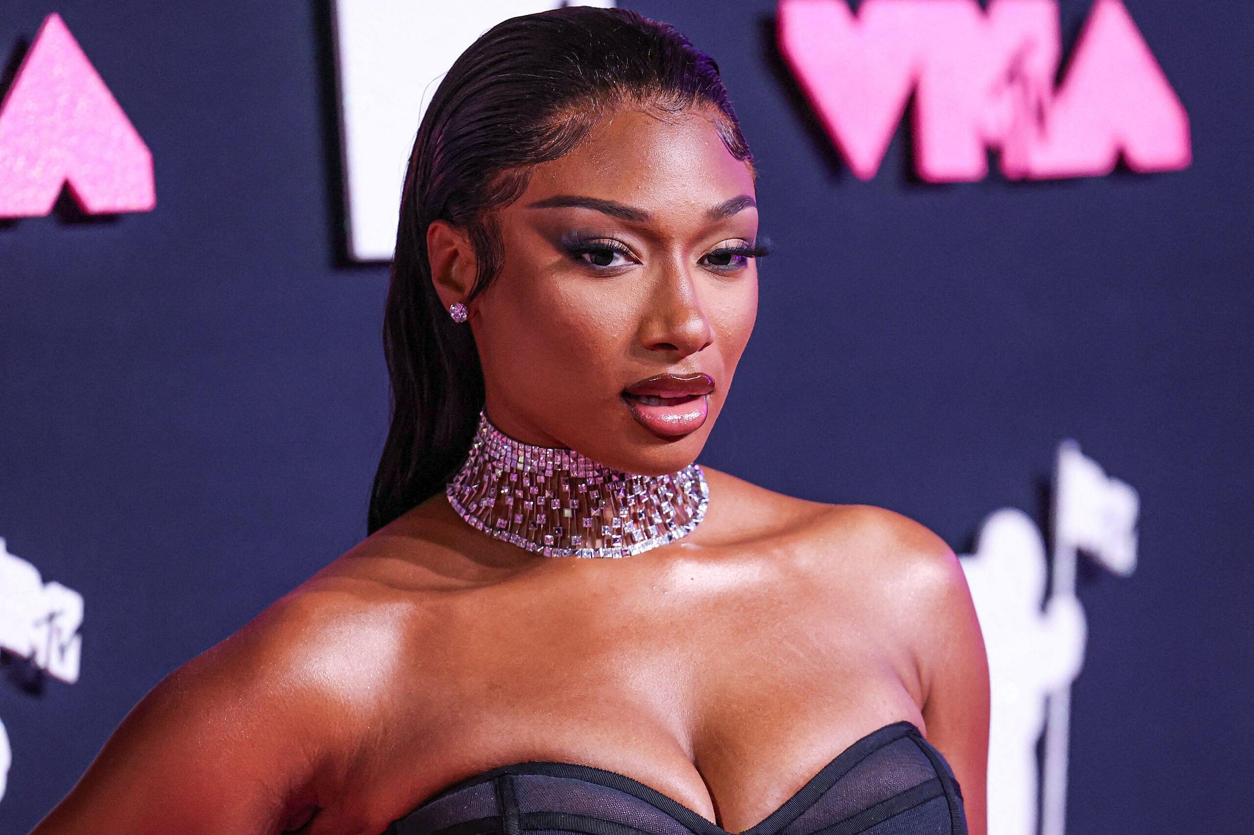 Megan Thee Stallion wearing a Brandon Blackwood dress and Jacob and Co. jewelry arrives at the 2023 MTV Video Music Awards