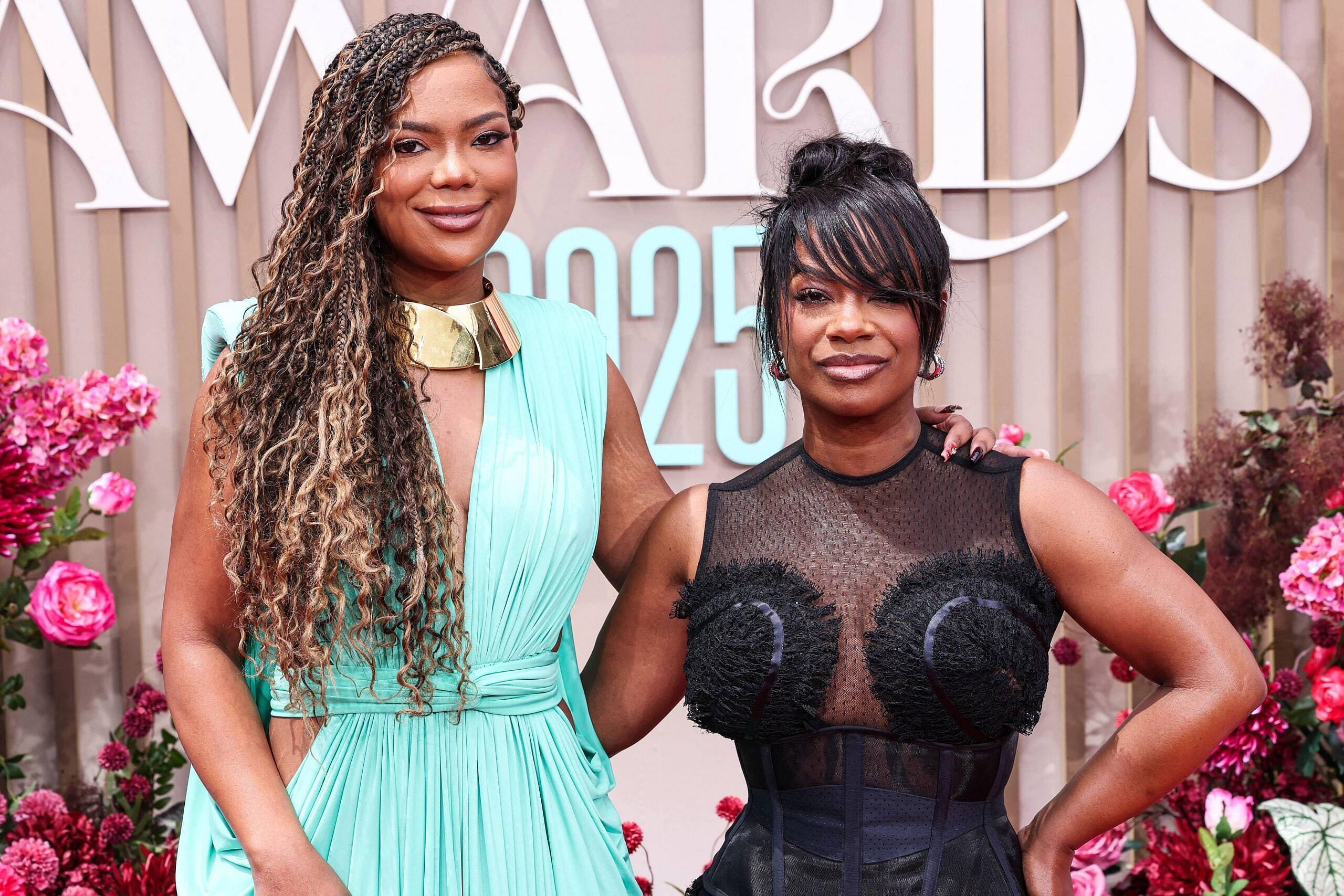 Riley and Kandi Burruss posing on the red carpet at the BET Awards.