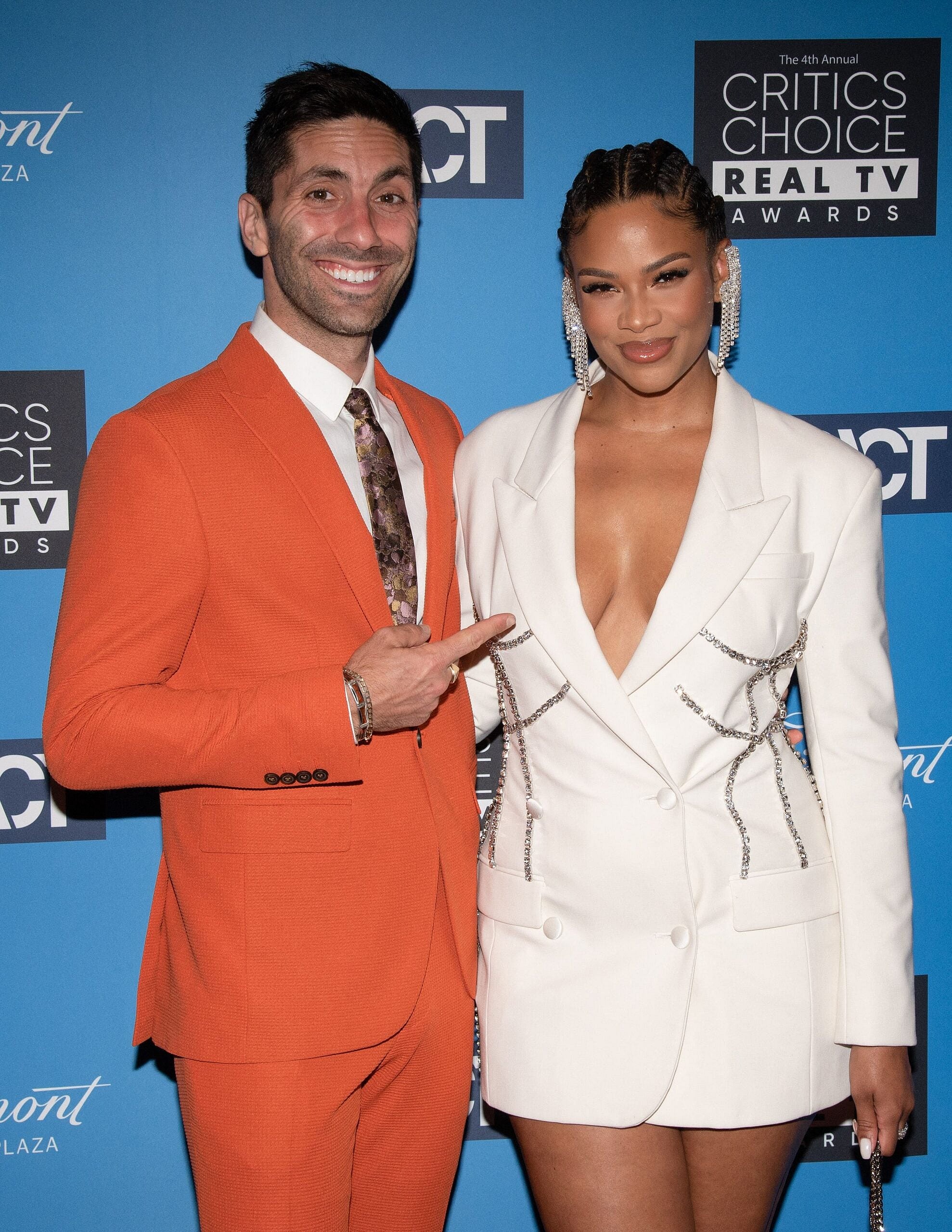 Nev Schulman and Kamie Crawford posing on the red carpet.
