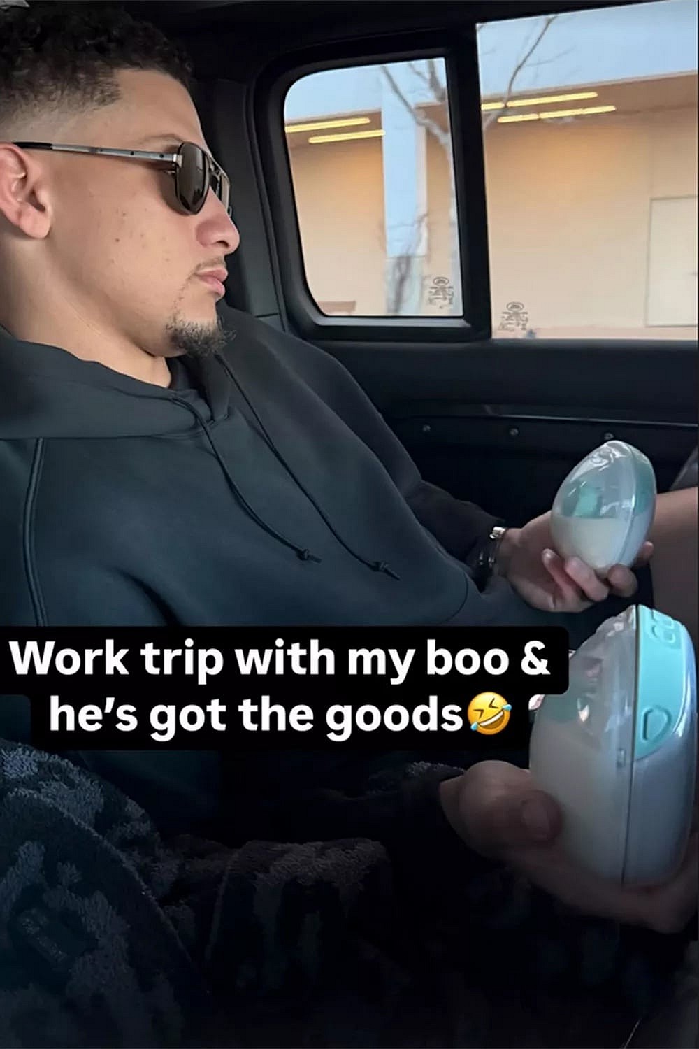 Patrick Mahomes holding two containers of wearable breast pumps
