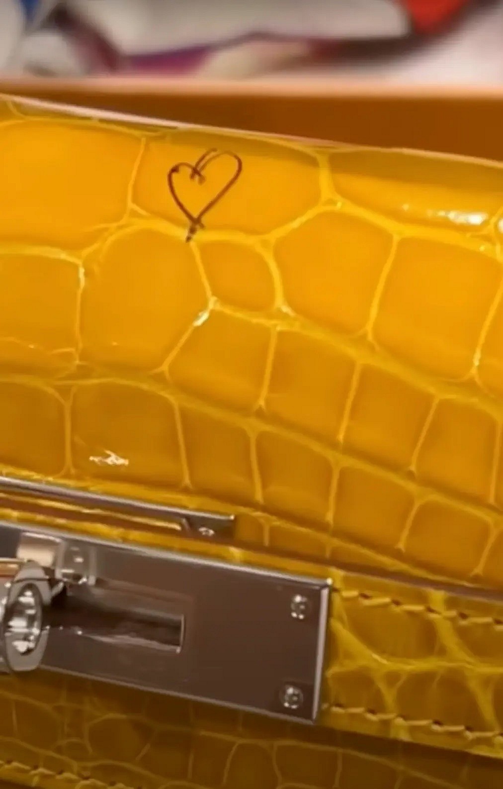 Kulture draws heart on Cardi B's bag