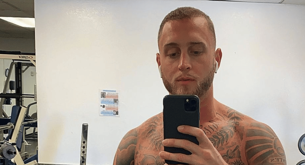 Chet Hanks flexing at the gym
