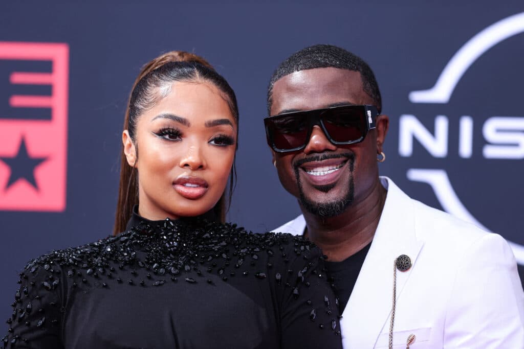 Ray J and Princess Love posing