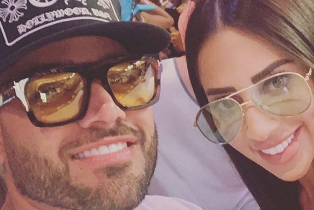 man and woman smiling for a photo