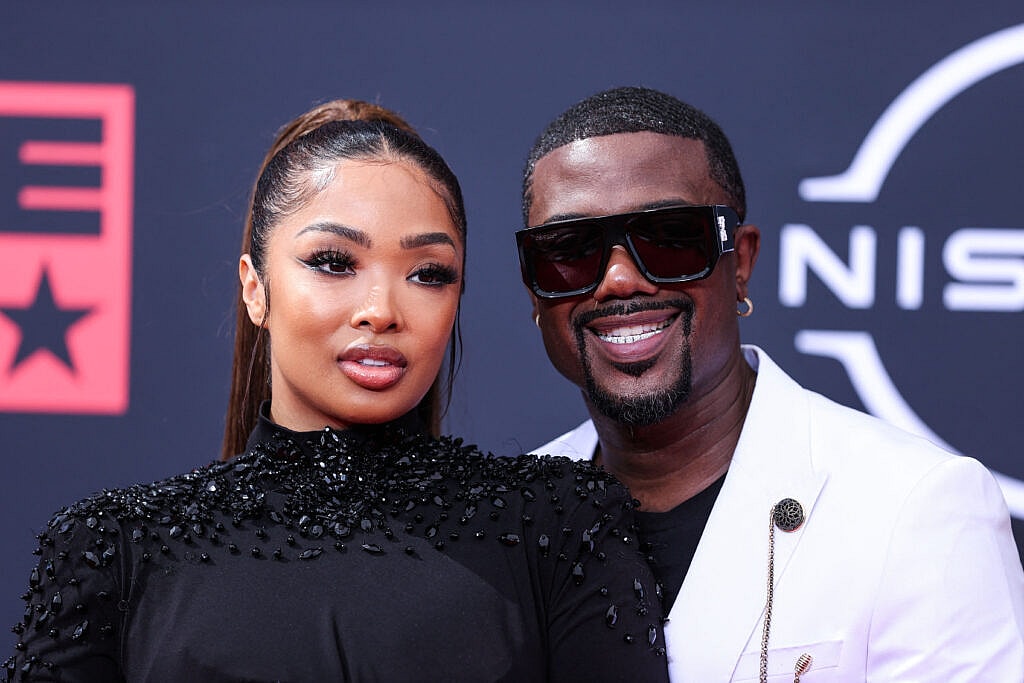 Ray J and Princess Love posing