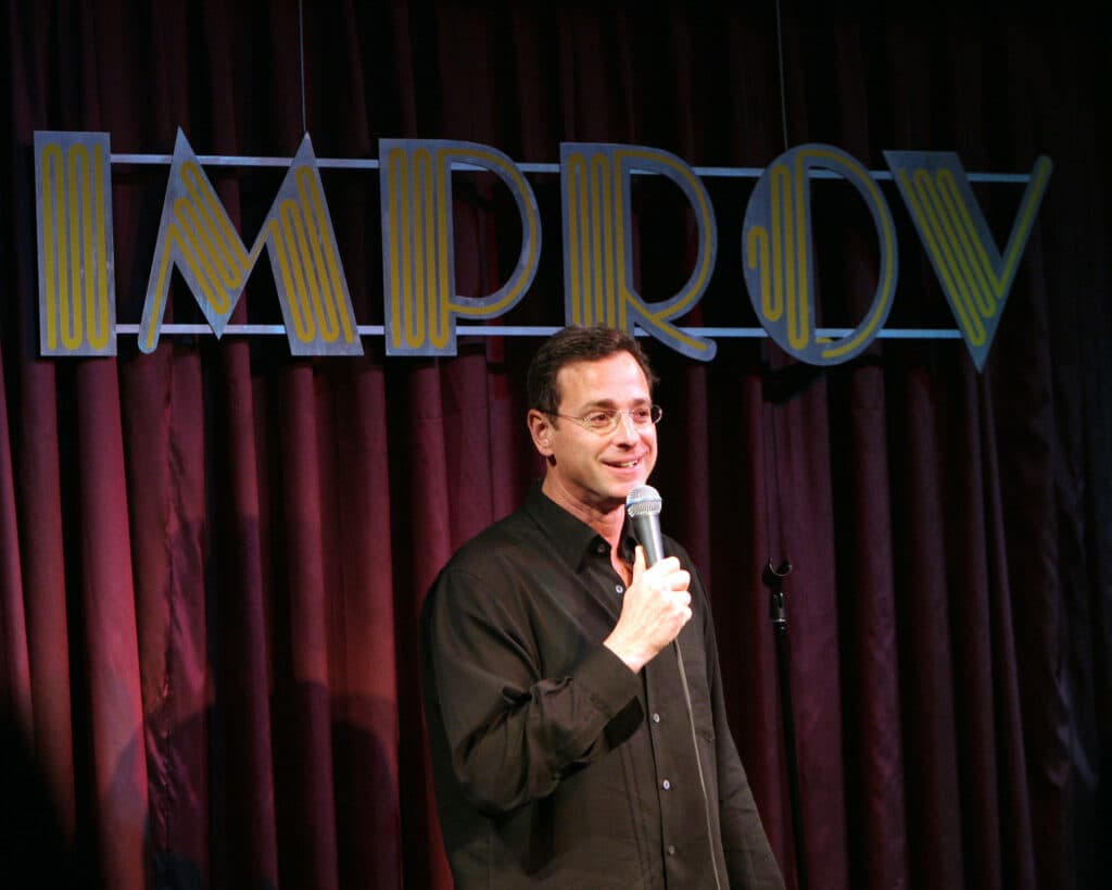 Bob Saget performs at the Improv Comedy Club