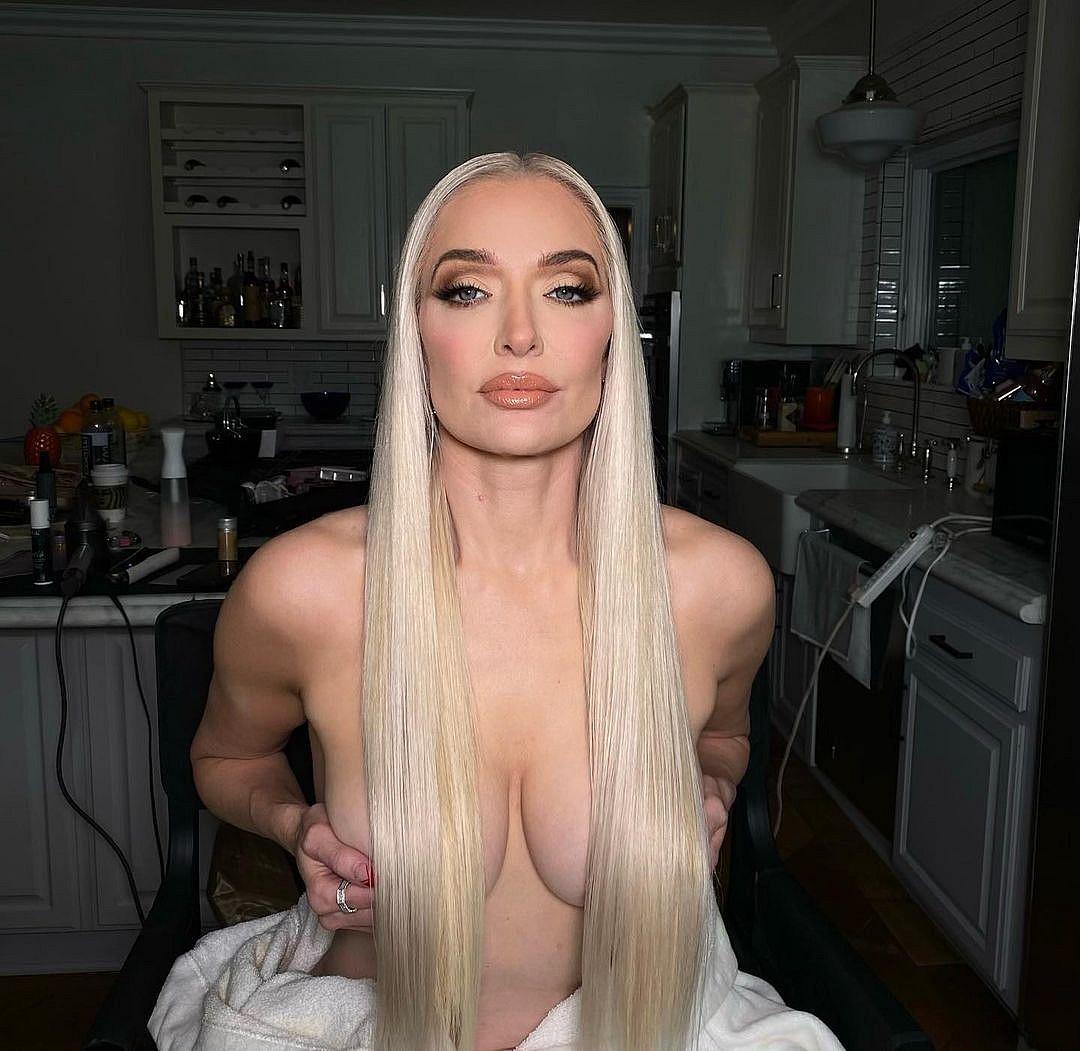 Erika Jayne posing without her top on.