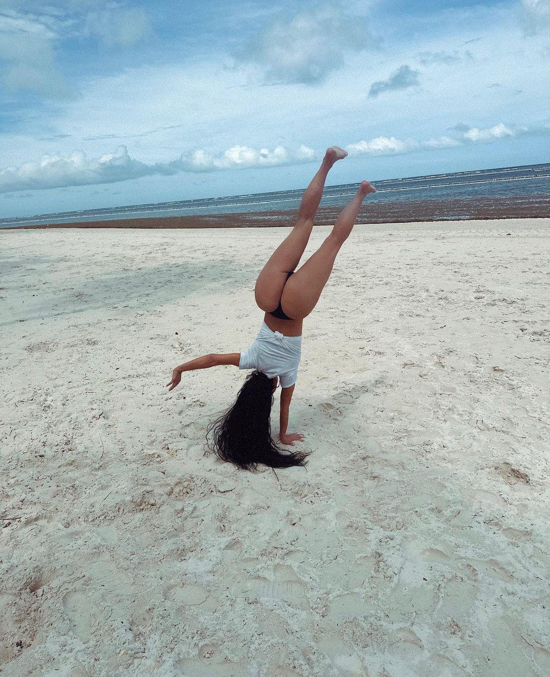 Billionaire Kim Kardashian Does A Cartwheel In A Thong On The Beach