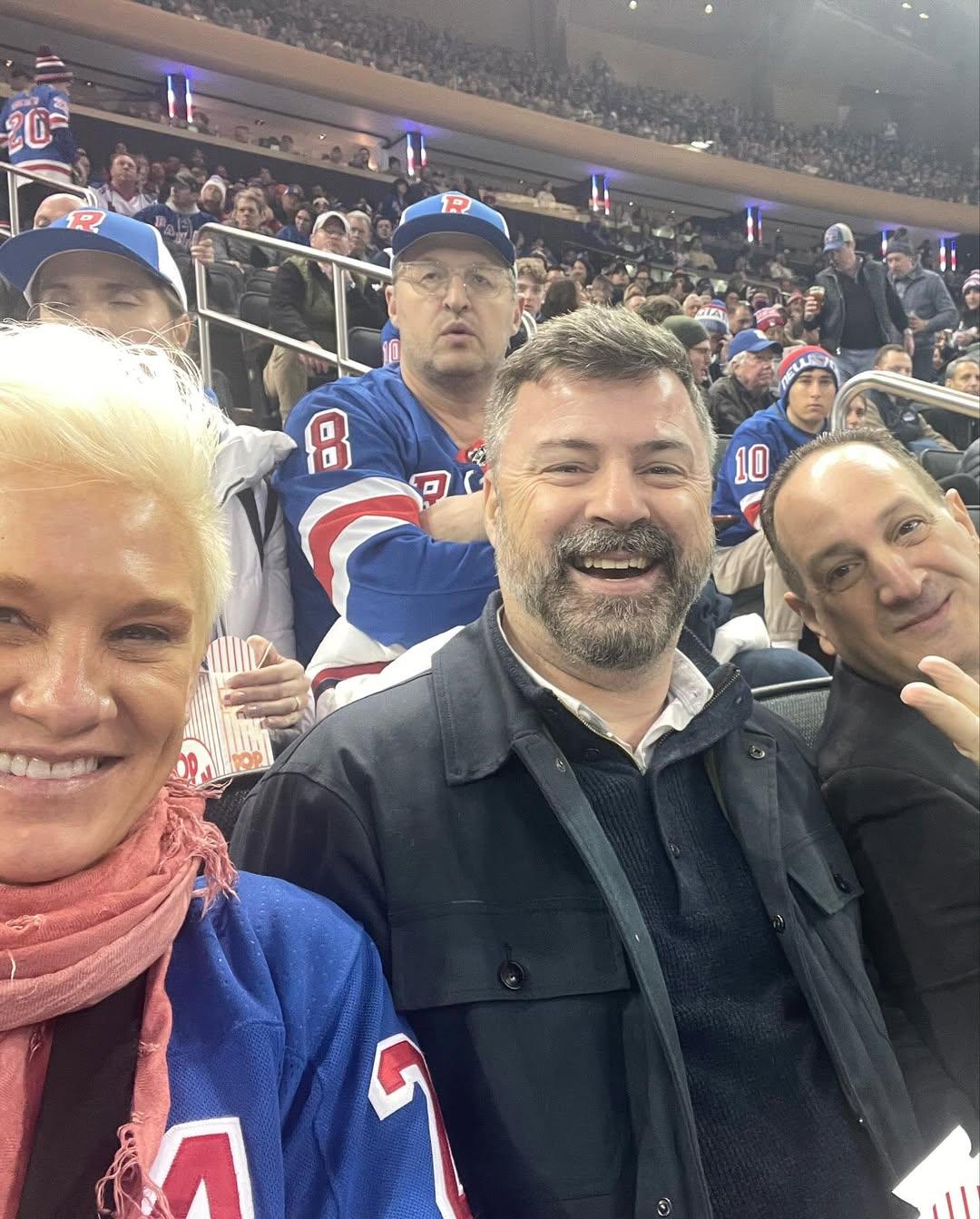 Anne Burrell and her husband watching a hockey game