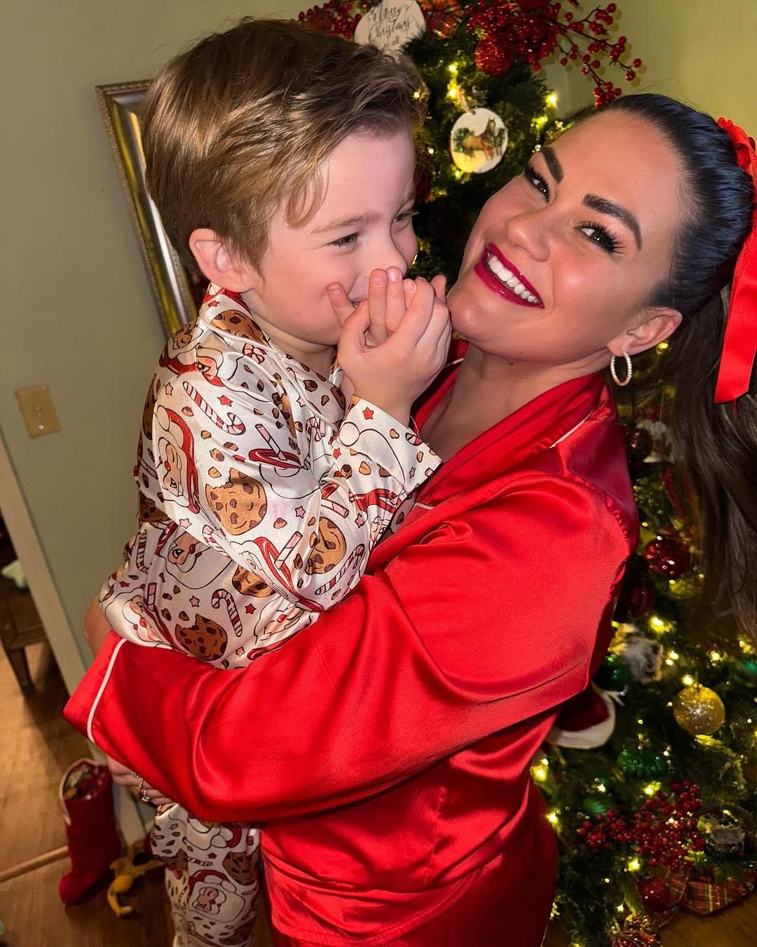 Brittany Cartwright and son Cruz posing in holiday pajamas. 