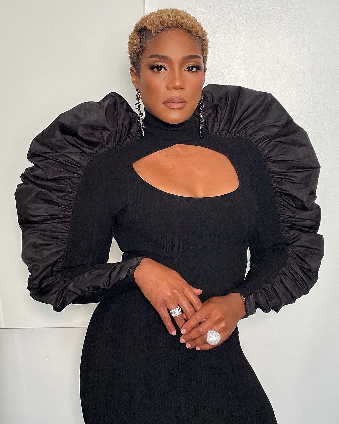 A photo showing Tiffany Haddish in a sizzling black dress.