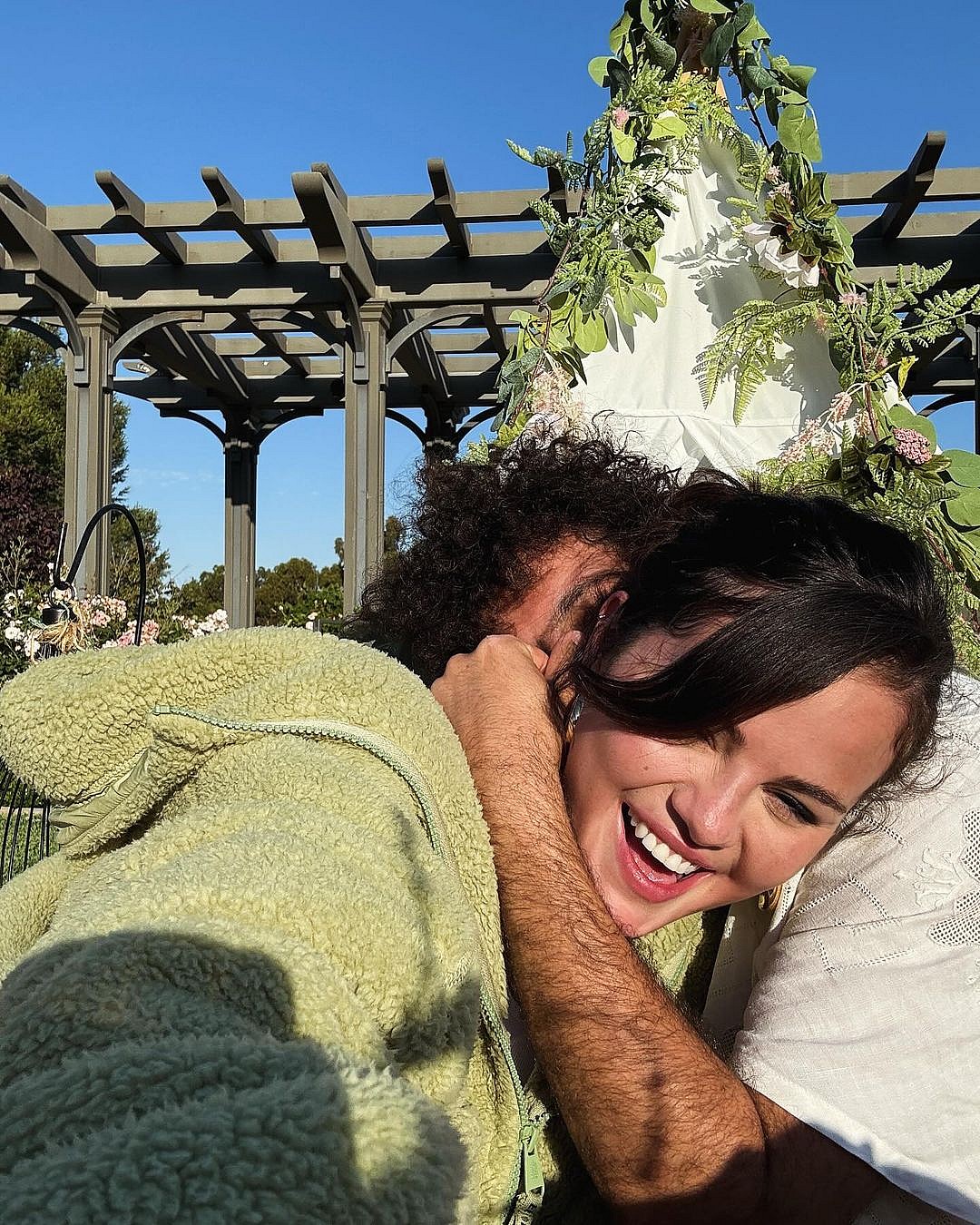 Selena Gomez laughing with Benny Blanco