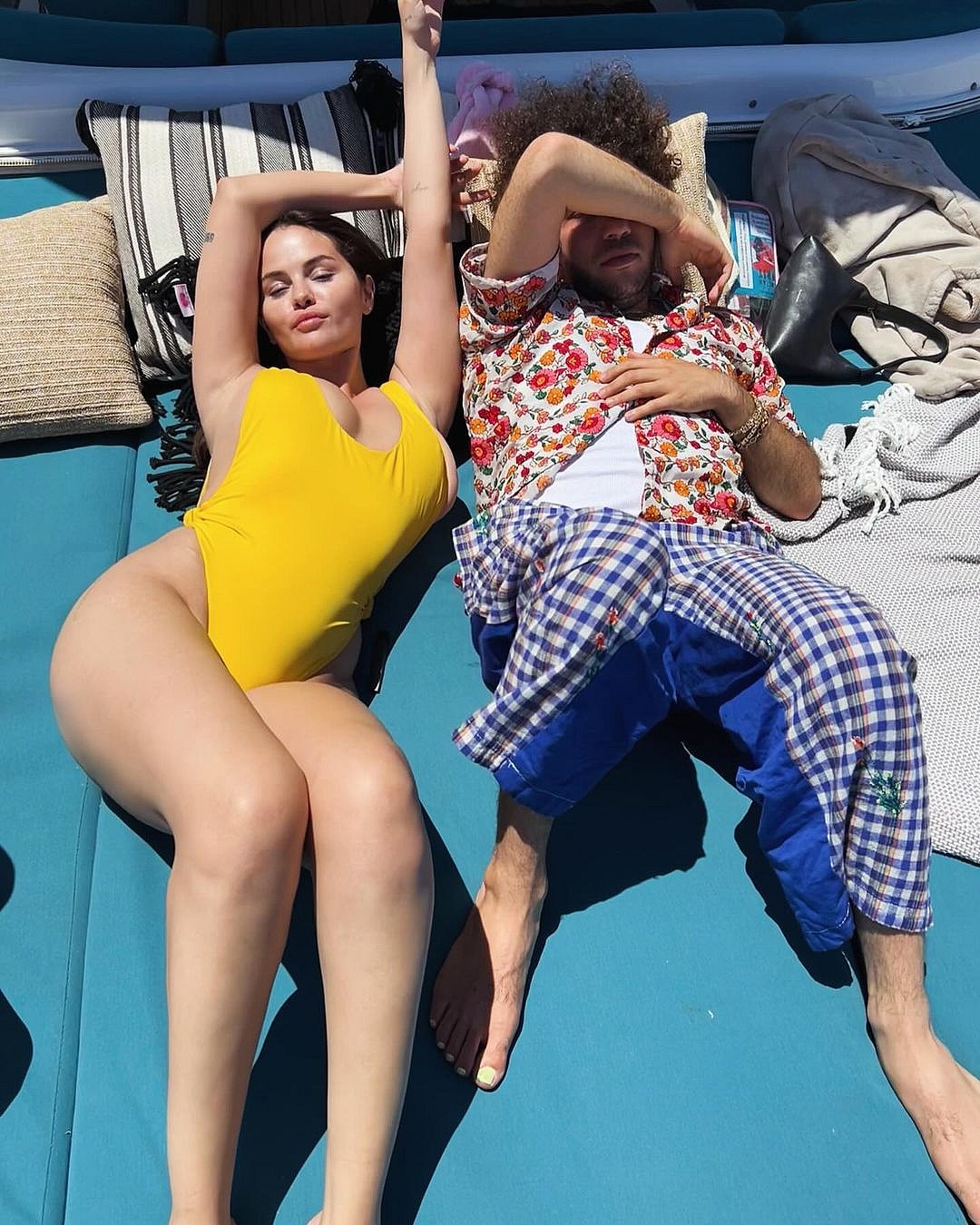 Selena Gomez and Benny Blanco relaxing in swimsuits