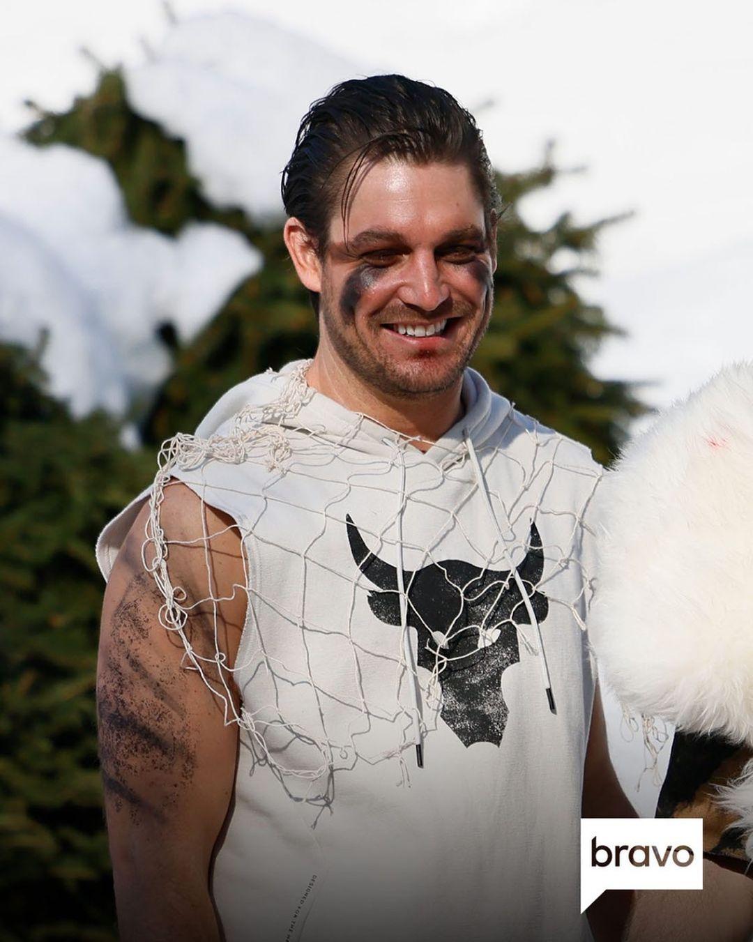 A photo showing Craig Conover in a white and black costume.