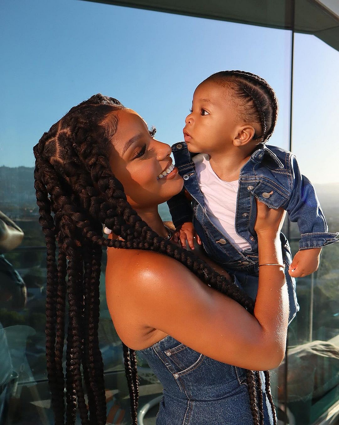 Halle Bailey holding her son