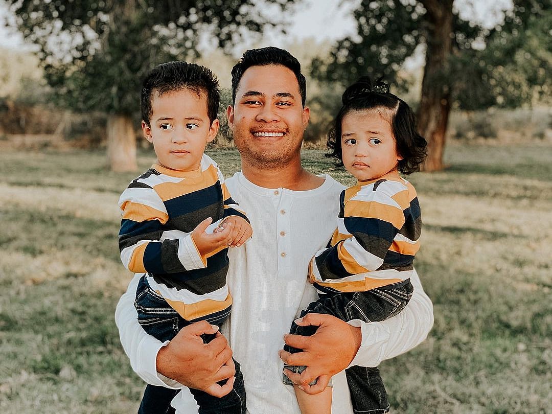 A photo showing Asuelu Pulaa and his sons