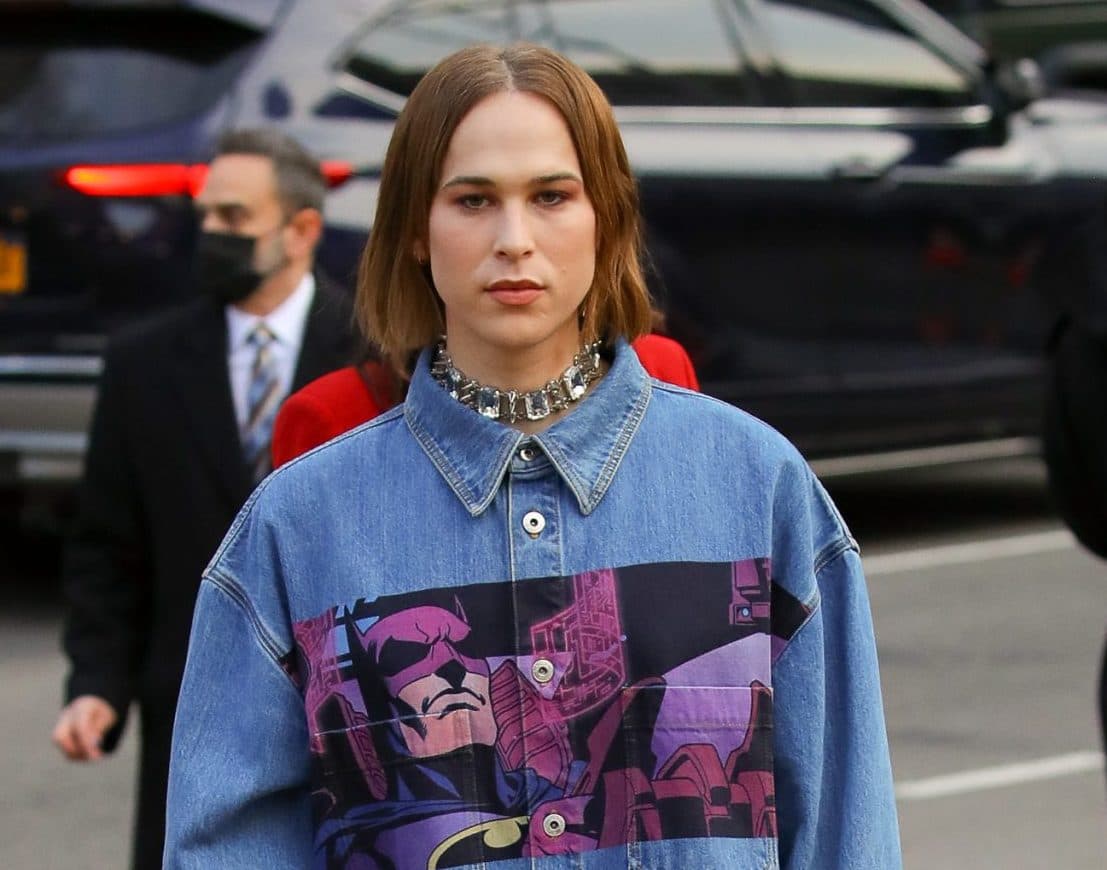 Tommy Dorfman wears a denim dress while attending at the The Batman premiere in New York City on Mar 01 2022