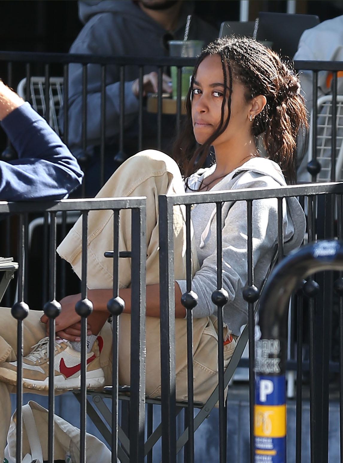 Malia Obama is seen out with a friend grabbing a coffee on Melrose Place