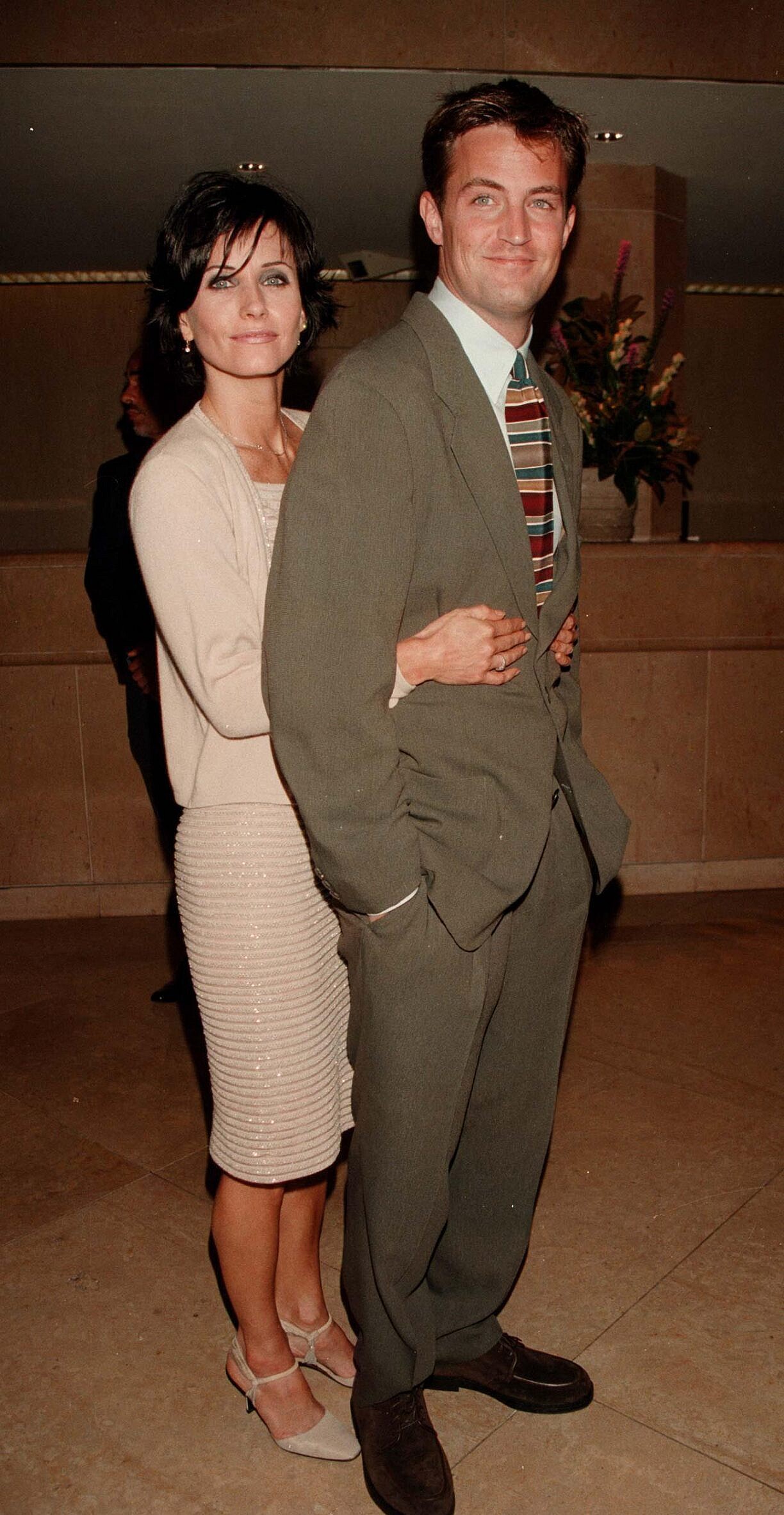 Courteney Cox hugging Matthew Perry