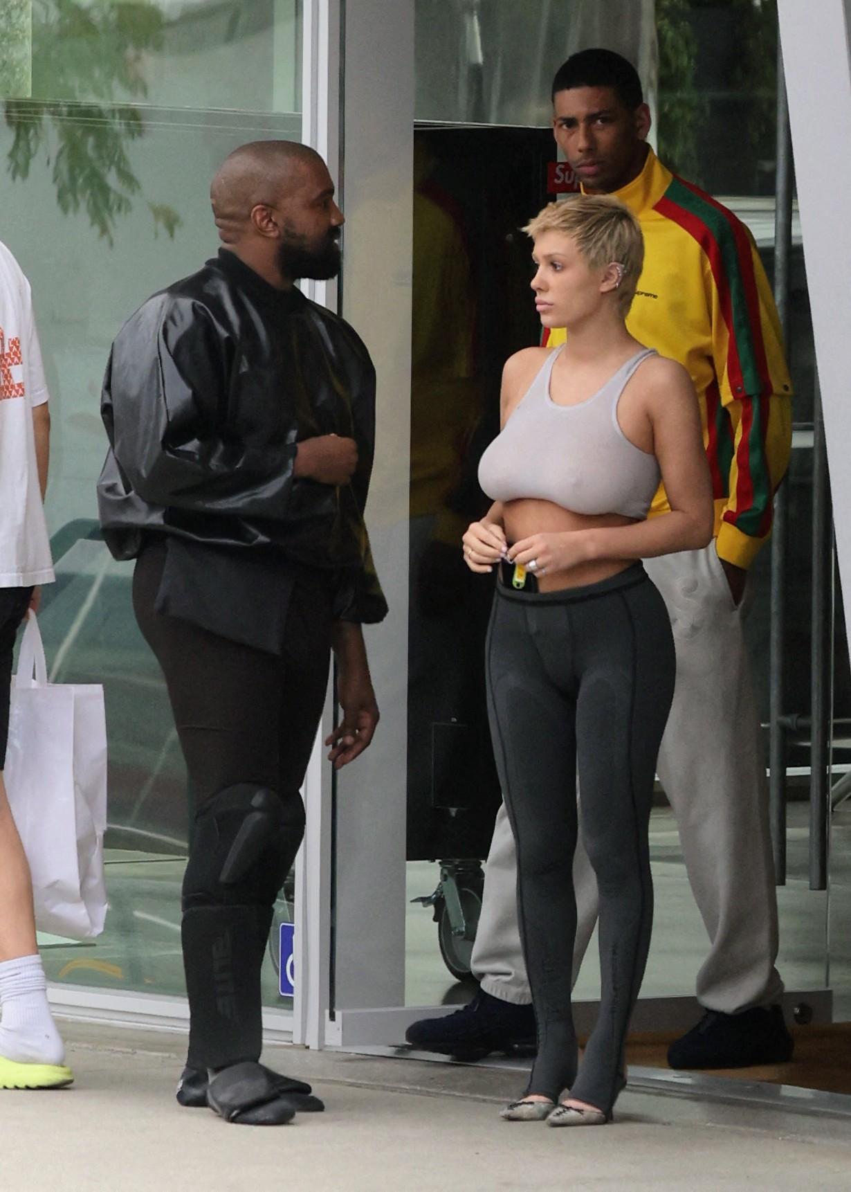 Kanye West seen in good spirits while shopping SUPREME and showing off his hummer with wife Bianca and friend