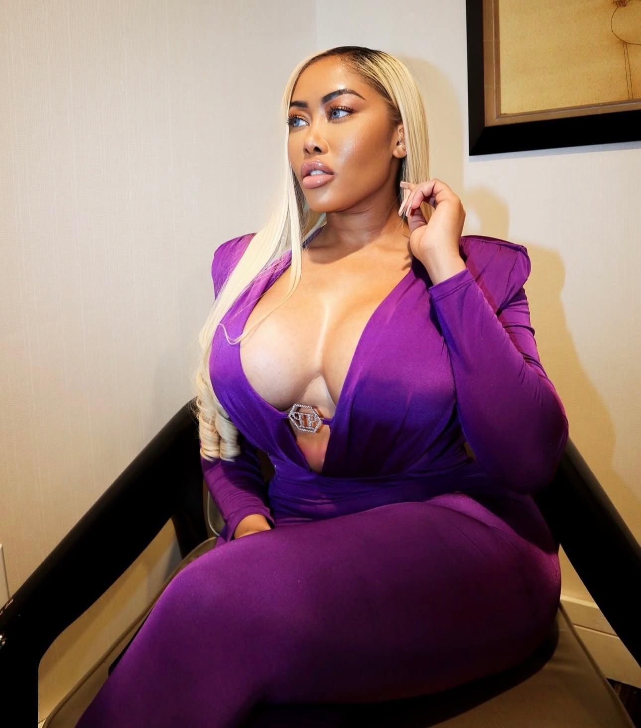 Moriah Mills in purple outfit
