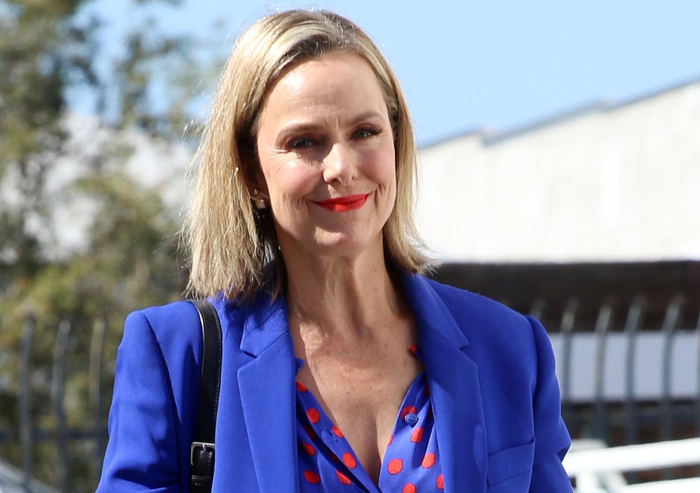 Melora Hardin all smiles heading in for dance practice