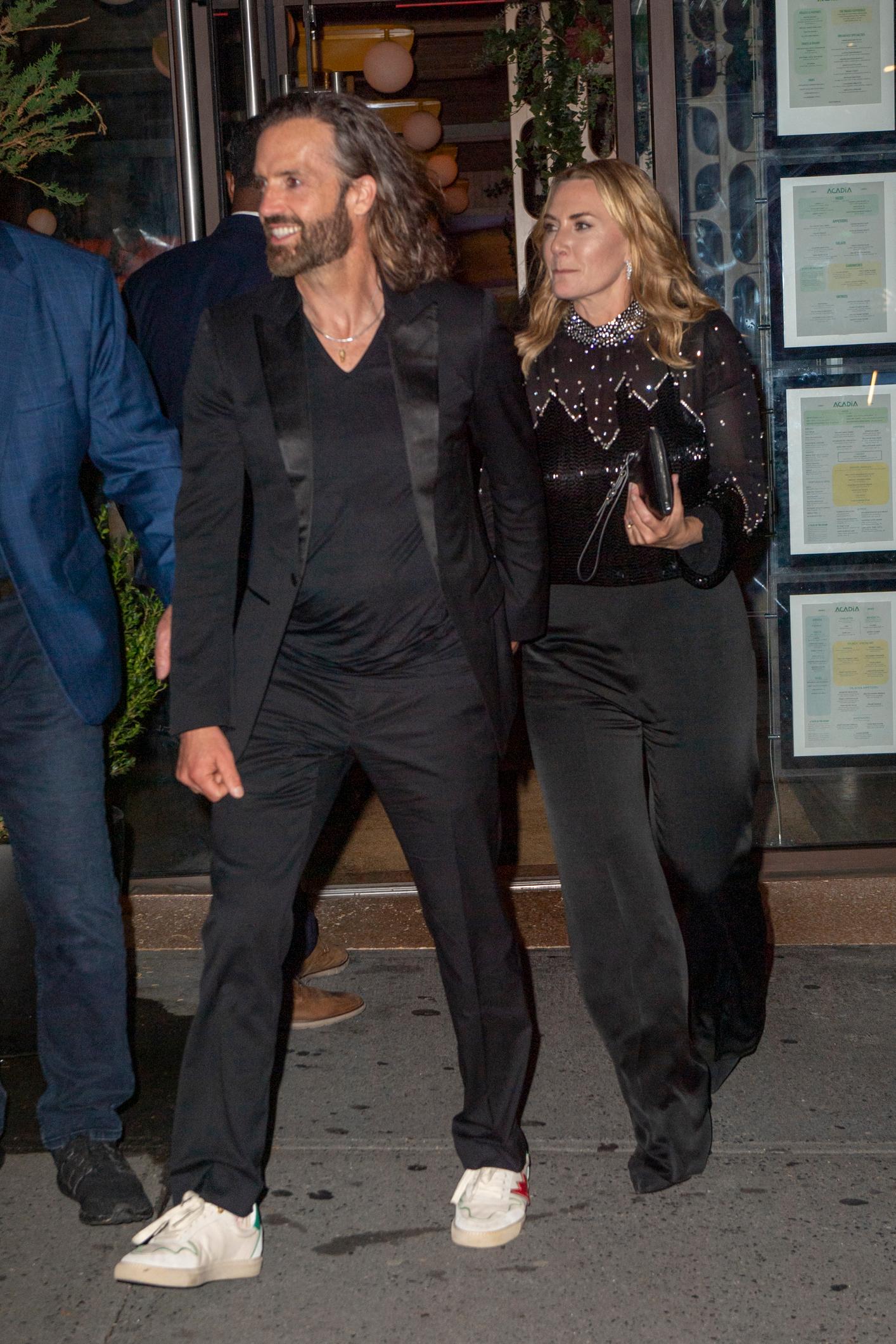 Kate Winslet and her husband Edward Abel Smith hold hands after movie after party