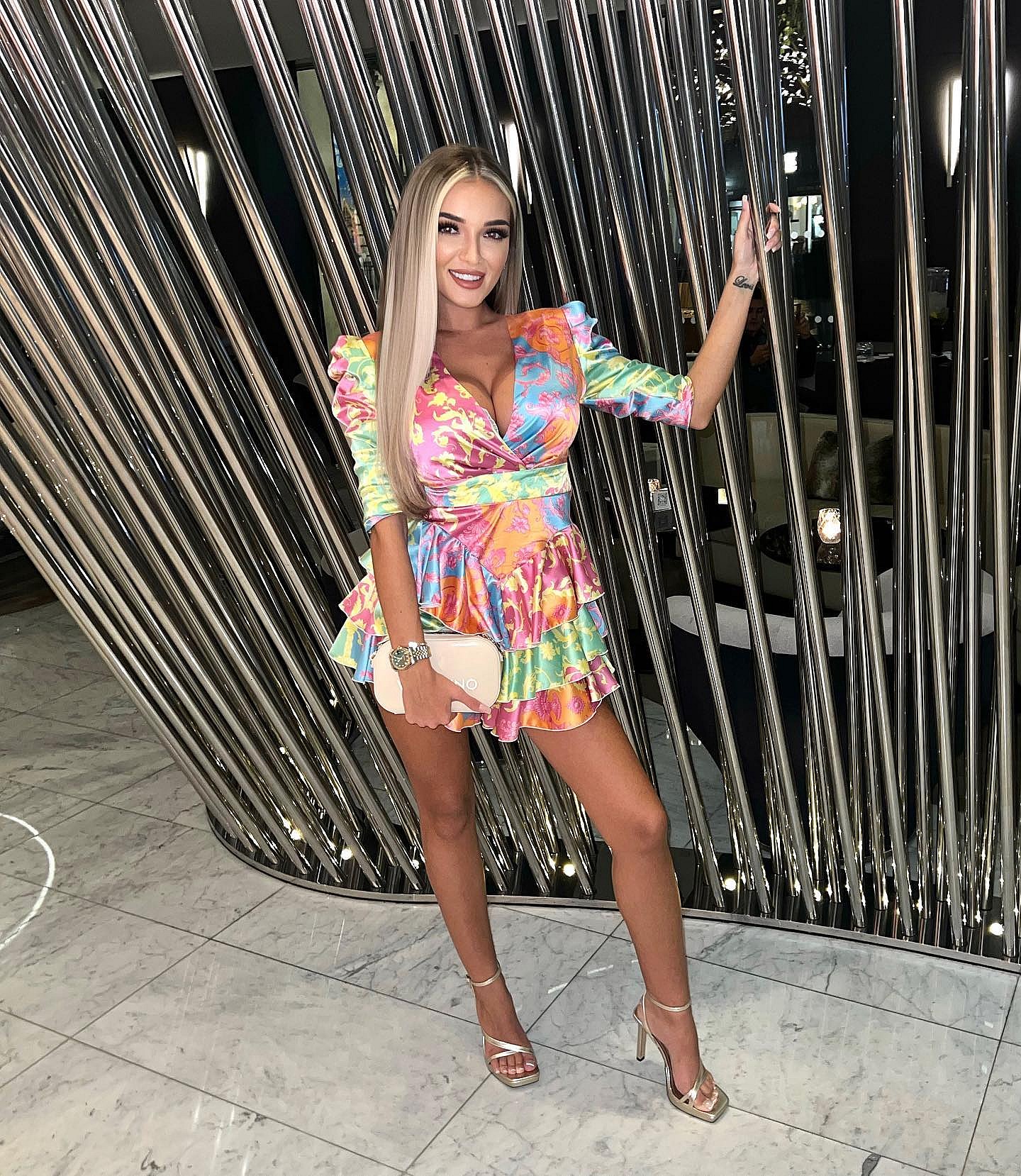 Beaux Raymond in a rainbow-colored dress