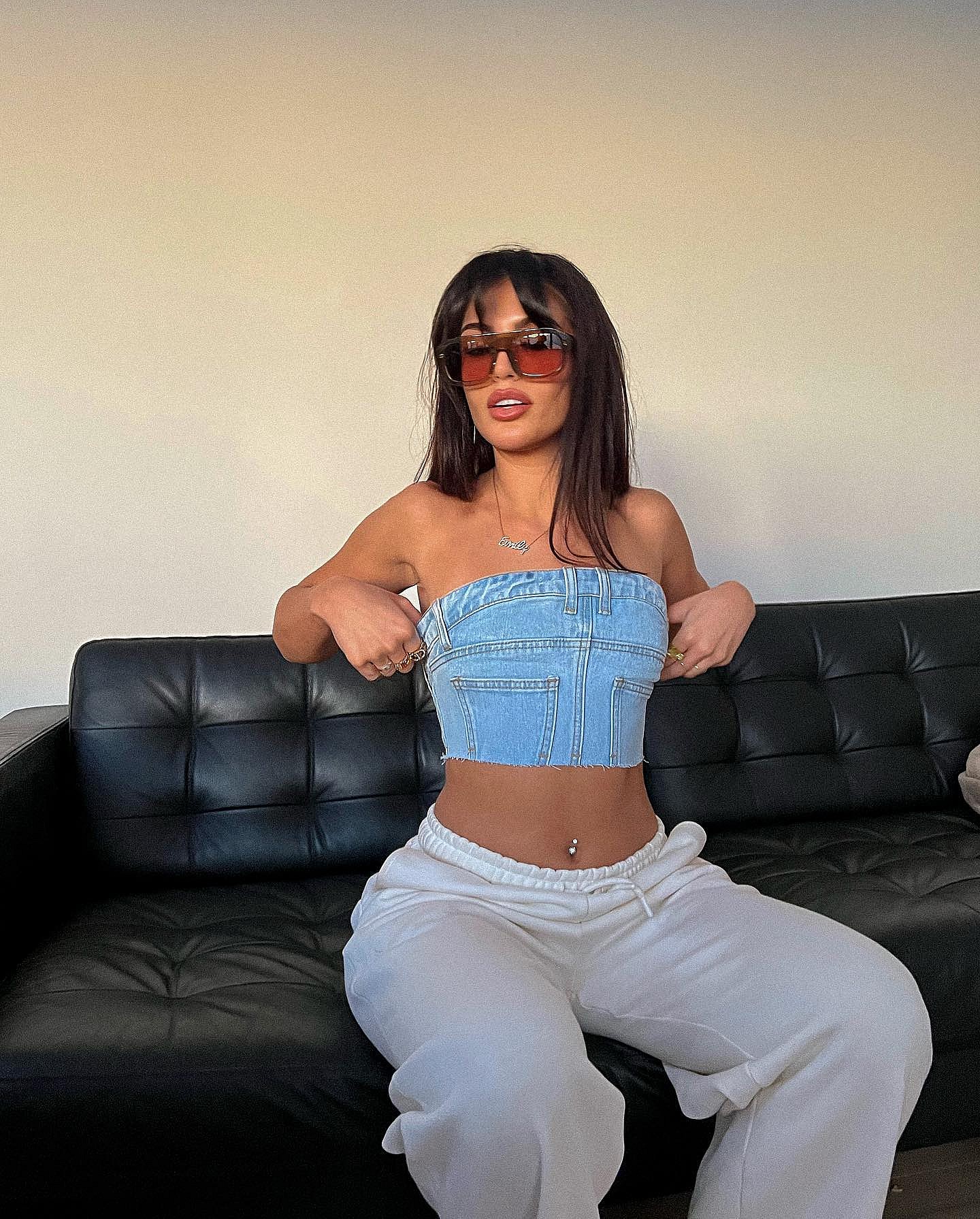 Emily Faye Miller poses in a denim bra