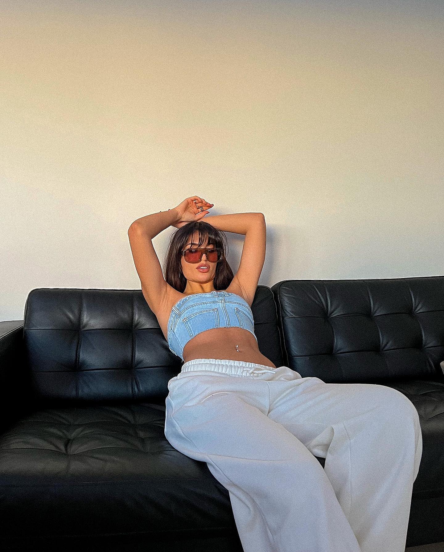 Emily Faye Miller poses in a denim bra