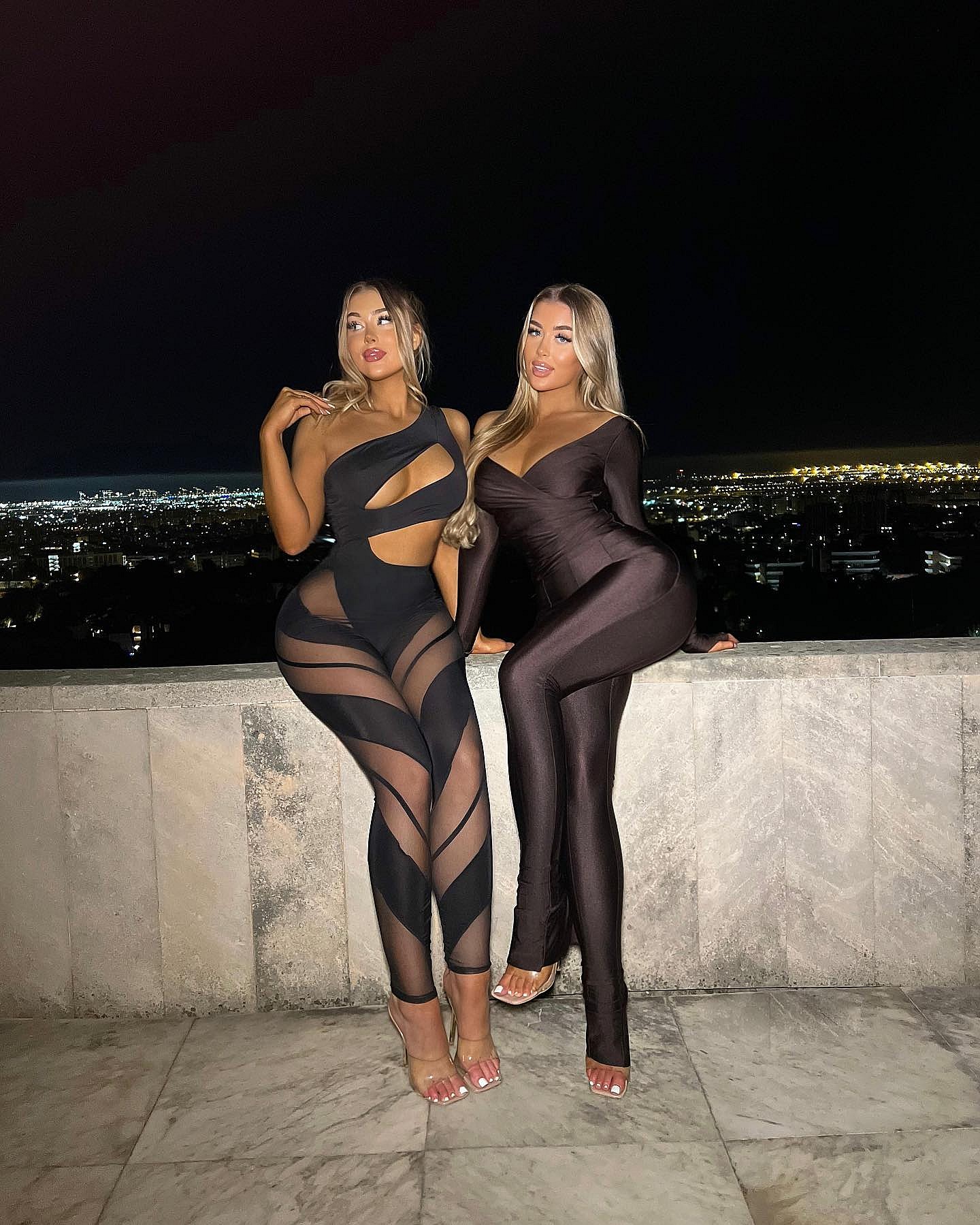 Eve Gale and Jessica Rose Gale pose in sheer bodysuits