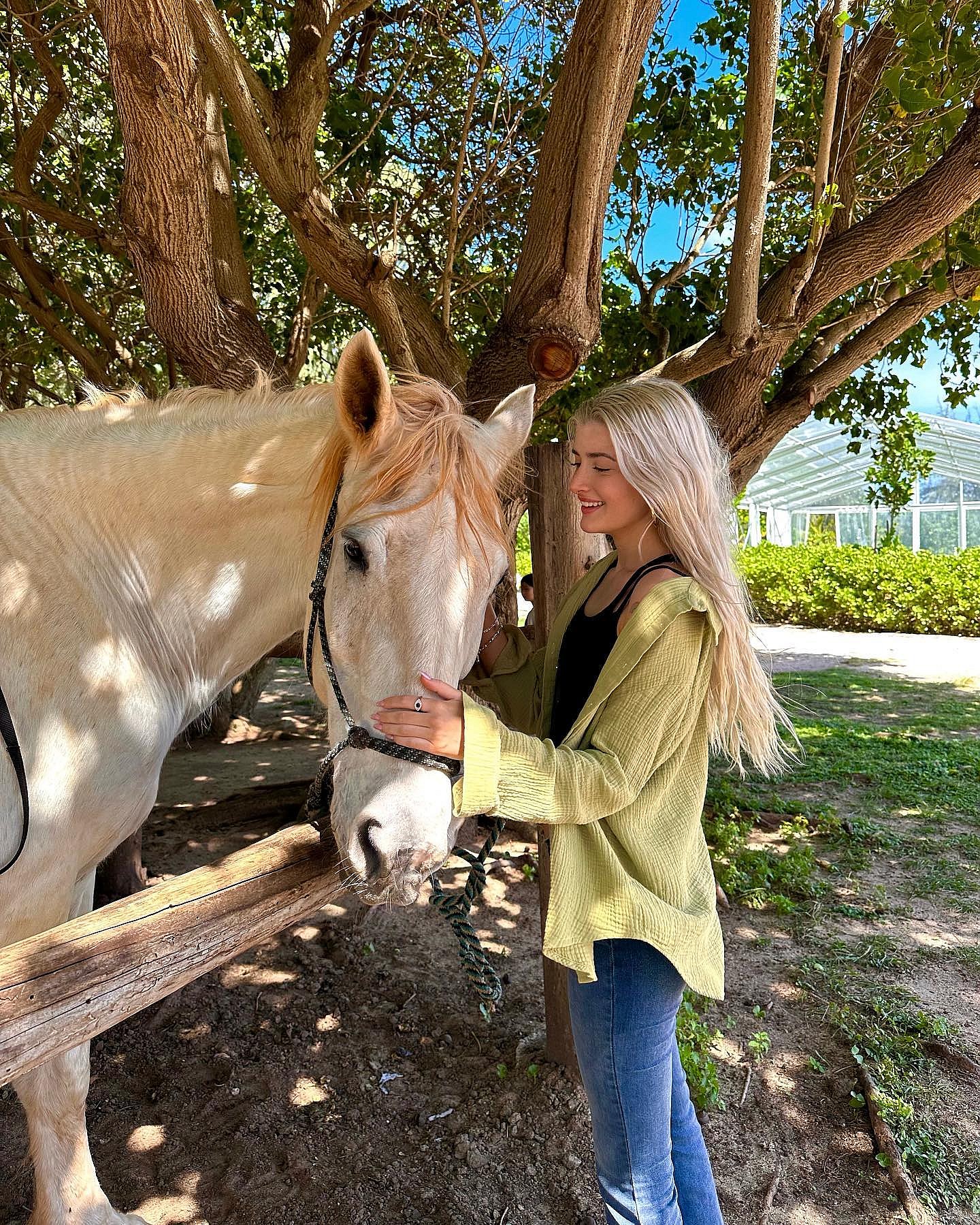 Sami Sheen Poses With A Horse