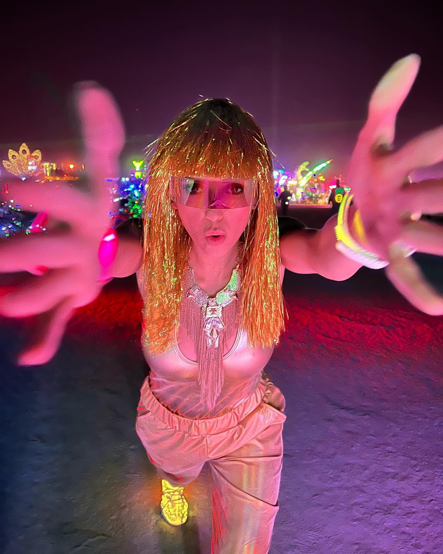 Nina Dobrev in her gold costume at Burning Man 2022