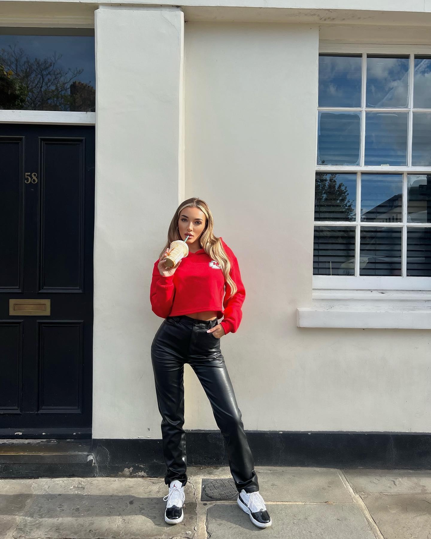 Beaux Raymond in a red hoodie and black pants