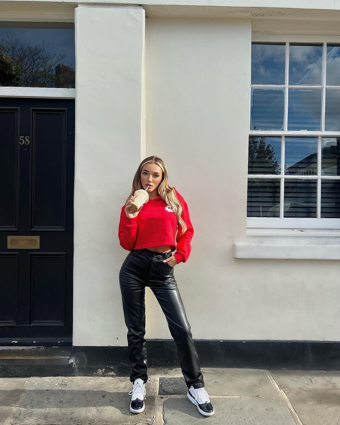 Beaux Raymond in a red hoodie and black pants