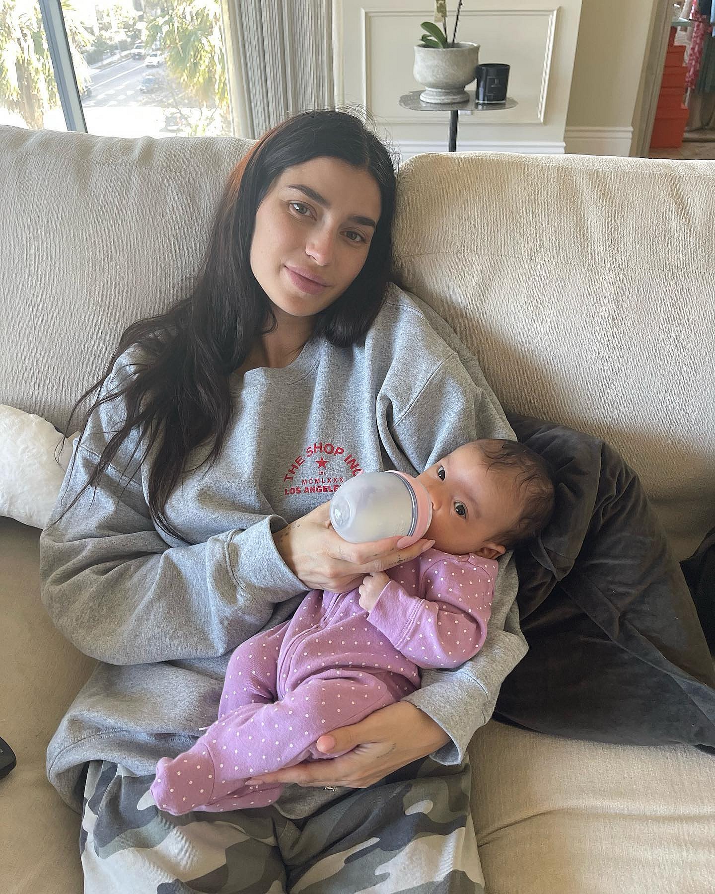 Nicole Williams English nursing her new baby