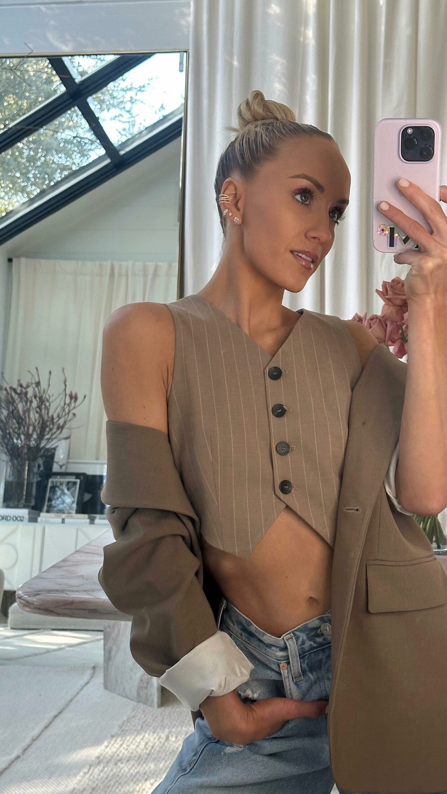 Nastia Liukin flaunts her toned abs in baggy jeans