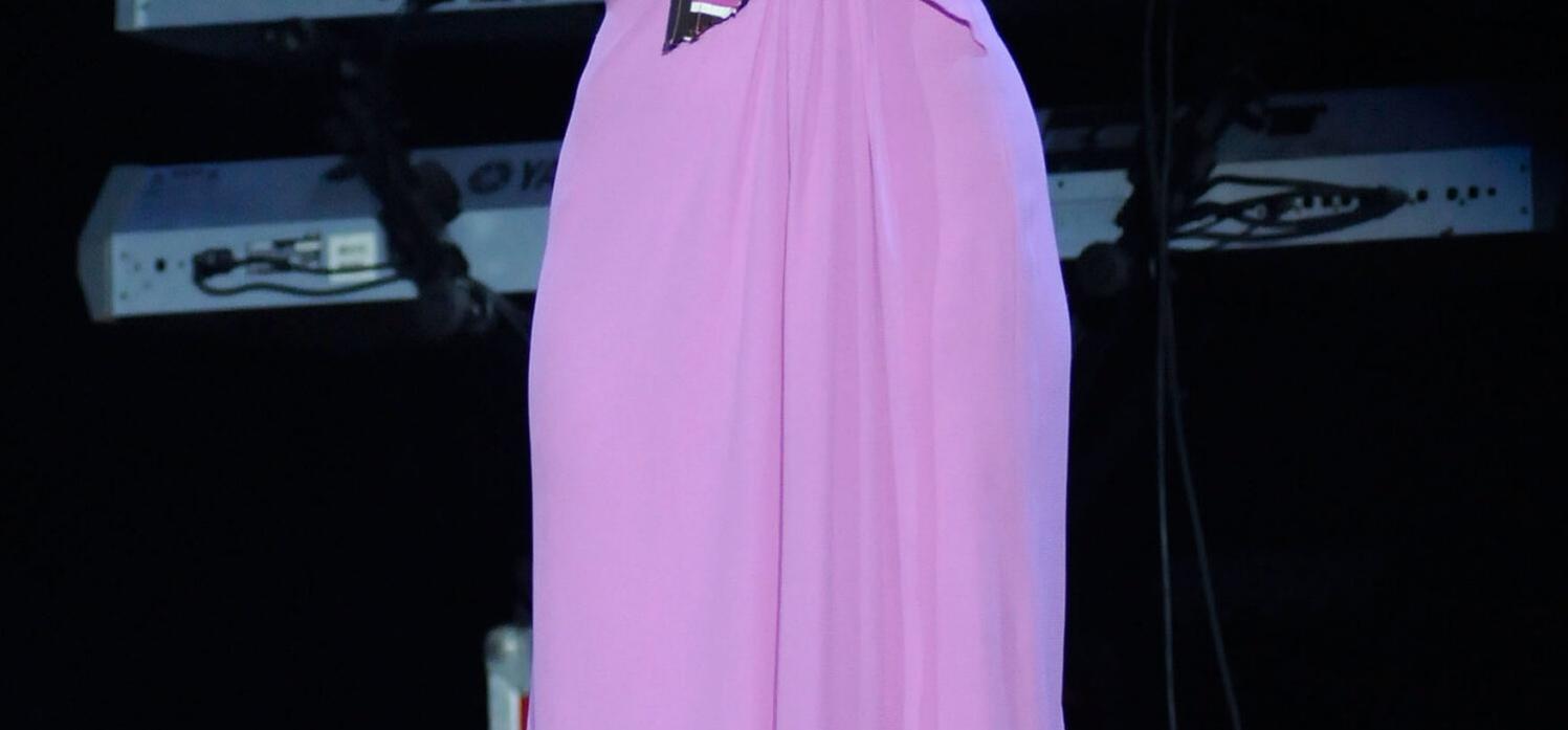 Shakira wearing a purple gown