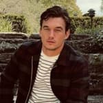 Tyler Cameron sitting on a flight of stairs