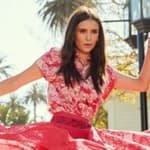 A photo of Nina Dobrev in a pink dress