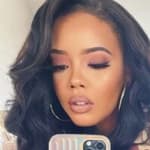 Angela Simmons in a brown bodysuit.