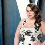 A photo of Beanie Feldstein in a flowered dress at the Vanity Fair event