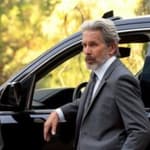 A photo showing Mark Harmon and his colleague standing by a vehicle.
