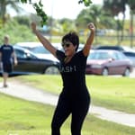 Kris Jenner celebrating with her hands up in the air