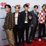 BTS members posing for the camera.