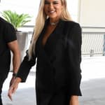 Khloe Kardashian shows off her legs in a tiny minidress while rocking a pink diamond ring from ex-boyfriend Tristan Thompson at a mall in Miami