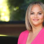 Chrissy Teigen smiling.